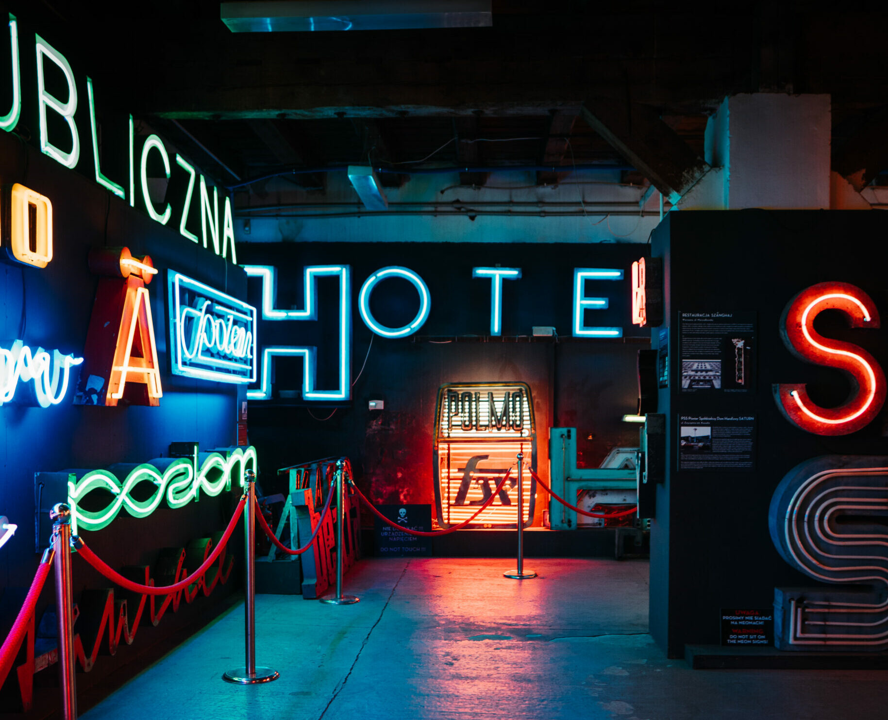 Glowing neon signs on walls of a museum
